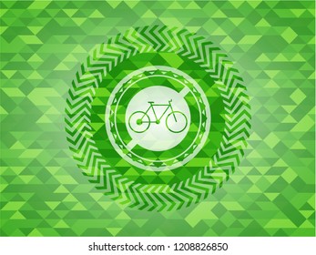 bike icon inside green emblem with mosaic background