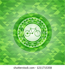 bike icon inside green emblem with mosaic background