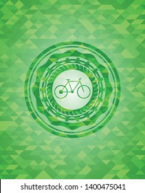 bike icon inside green emblem with mosaic background