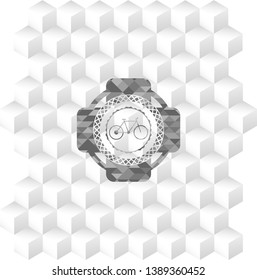 bike icon inside grey badge with geometric cube white background