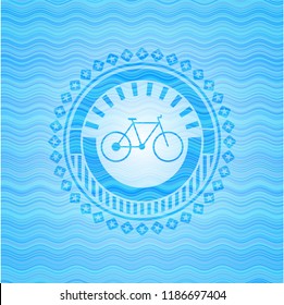 bike icon inside light blue water wave style emblem.