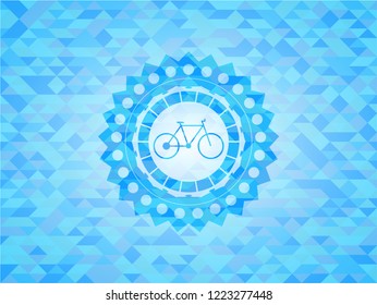 bike icon inside light blue emblem with triangle mosaic background
