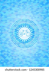 bike icon inside light blue emblem. Mosaic background