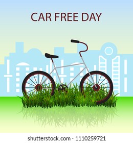 The bike on the green grass in front of city silhouette. Vector illustration of Bike lifestyle.