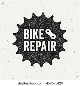 Bike Repair Logo. Bicycle Sprocket. Ink Stamp Style.