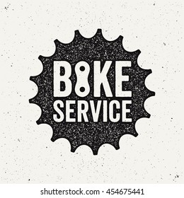 Bike Service Logo. Bicycle Sprocket. Ink Stamp Style.