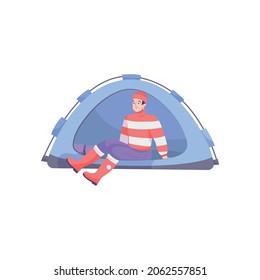 Bike tourism flat composition with male character of tourist in warm clothes sitting in tent vector illustration
