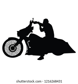 Biker driving a motorcycle rides along the asphalt road vector silhouette illustration. Freedom concept. Man on bike silhouette.
