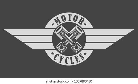 Biker emblem pistons wings and text on gray background