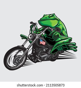 Biker Frog On His American Motorcycle Speeding Away. Toad Riding A Black Motorcycle With An American Flag Sticker On The Fuel Tank.