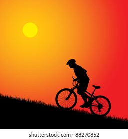 Biker silhouette on the sunset
