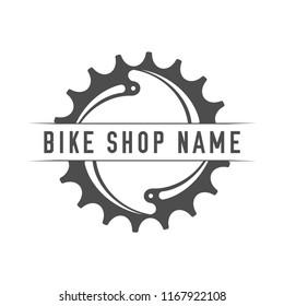 Bikes Shop Emblem. Design Element for Bike Shop or Advertising Banner. Chainring and Place for Your Bike Shop Name, Monochrome Vector Illustration.