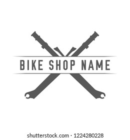 Bikes Shop Emblem. Design Element for Bike Shop or Advertising Banner. Crossed Forks and Place for Your Bike Shop Name, Monochrome Vector Illustration.