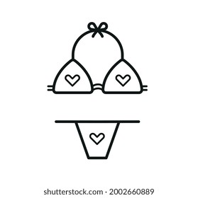 Icono del corazón de Bikini en la playa
