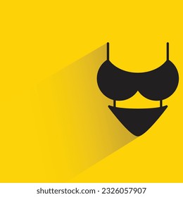 bikini with shadow on yellow background