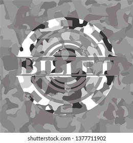 Billet written on a grey camouflage texture