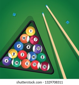 Billiard cue and pool balls in triangle on green table while game. Biliard balls, triangle and pool stick for game on green table top view