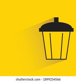 bin with drop shadow on yellow background