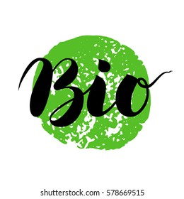 Bio Brush Lettering. Modern Hand Drawn Ecological Food Icons and Badges. Brush Calligraphy Creative Composition isolated on white with green print.