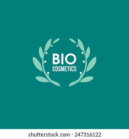 Bio cosmetics logo design vector template. Wreath of green branches with leaves and white berries