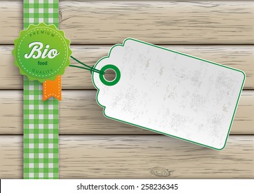 Bio food label with price sticker on the wooden background. Eps 10 vector file.