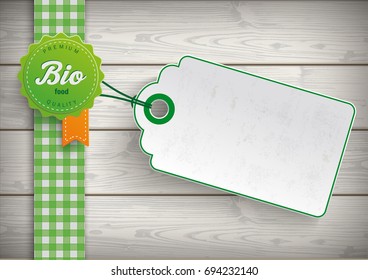 Bio food label with price sticker on the wooden background. Eps 10 vector file.