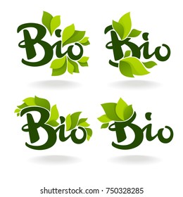 Bio labels with lettering composition and green leaves