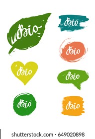 Bio set: hand drawn logos, labels with spots. Vector illustration eps 10 for food, drink, restaurants, menu, markets, organic products, package. Brush lettering, calligraphy.