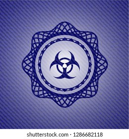 biohazard icon inside badge with denim texture