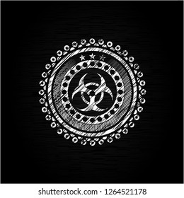 biohazard icon inside chalkboard emblem written on a blackboard