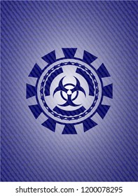 biohazard icon inside emblem with denim texture