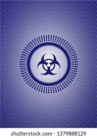 biohazard icon inside emblem with denim texture