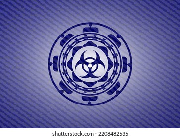 biohazard icon inside emblem with denim texture. 