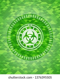 biohazard icon inside green emblem with mosaic background