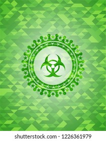 biohazard icon inside green mosaic emblem