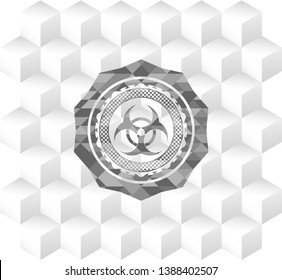 biohazard icon inside grey badge with geometric cube white background