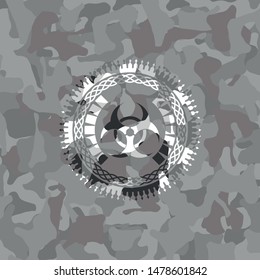 biohazard icon inside grey camo emblem
