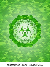 biohazard icon inside realistic green mosaic emblem