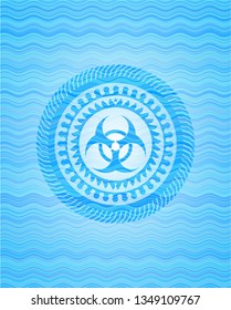 biohazard icon inside sky blue water wave badge.