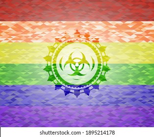 icono de riesgo biológico sobre fondo de mosaico con los colores de la bandera LGBT. 