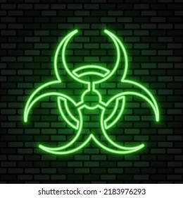 Biohazard neon icon. Green neon sign on dark brick wall. Best for polygraphy, mobile apps and web design.