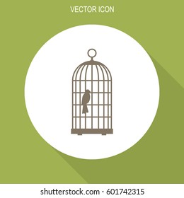 The bird in the cage vector icon.