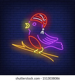 Bird in cap neon sign. Bird, cap, winter. Night bright advertisement. Vector illustration in neon style for banner, billboard
