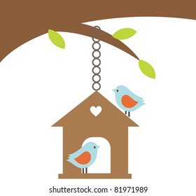 Bird couple with the house hanging on the tree