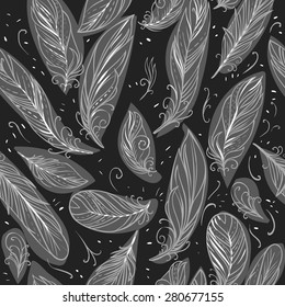 Bird feathers on black background. Vector seamless pattern