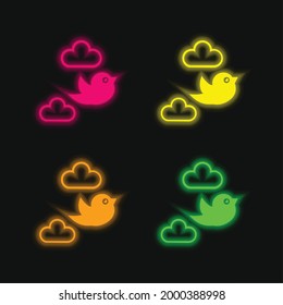 Bird Flying Between Clouds four color glowing neon vector icon