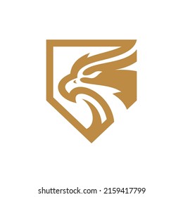 Bird head and shield logo design. Eagle, falcon or hawk badge emblem vector icon