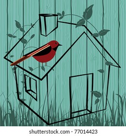 Bird house  in field / fence
