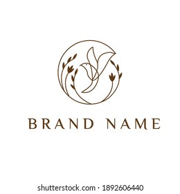 bird logo and floral circle on white background