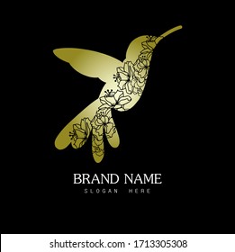  Logo de pájaro. Colibríes con flores talladas y fondo negro